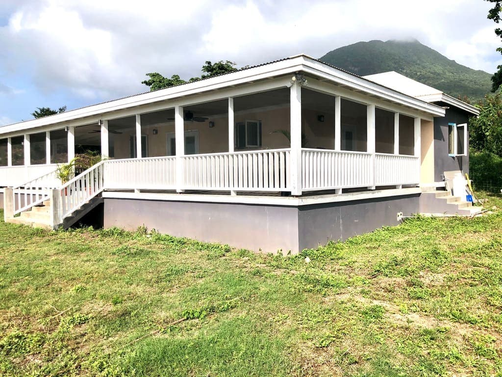 Modern single-story home with a spacious screened porch and mountain view in Evis, perfect for buyers seeking scenic and comfortable living.