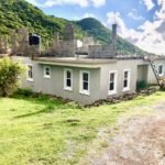 Newly constructed modern home with fresh exterior paint in Nepis, 17 Degrees North Realtors, Belize real estate listings.
