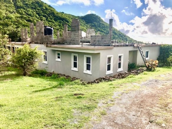 Newly constructed modern home with fresh exterior paint in Nepis, 17 Degrees North Realtors, Belize real estate listings.