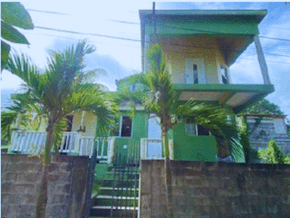7 Degrees North Realtors tropical home in Nevis with lush greenery and scenic views.